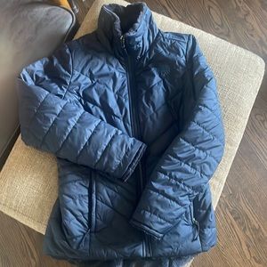 Women’s north face reversible fleece jacket.